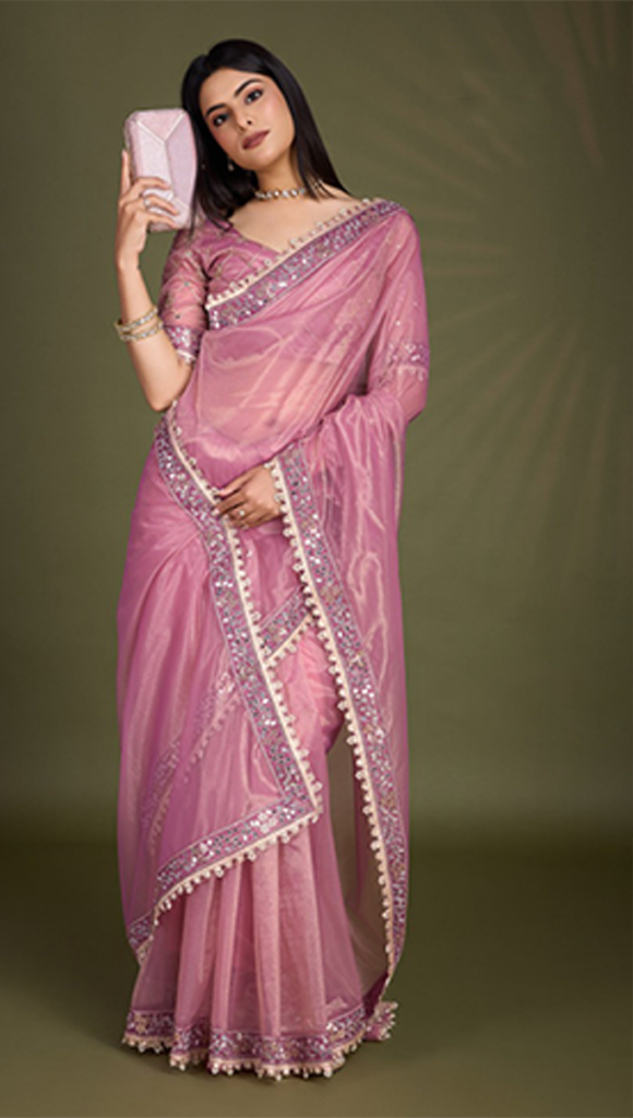 girls wearing light pink Fancy Sarees​